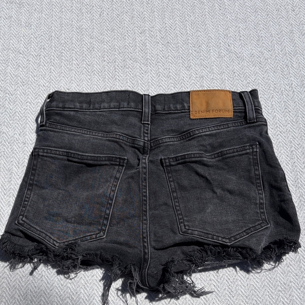 Denim Forum The Romy Slim Shorty Short.  Size 27.
Black denim cutoffs.